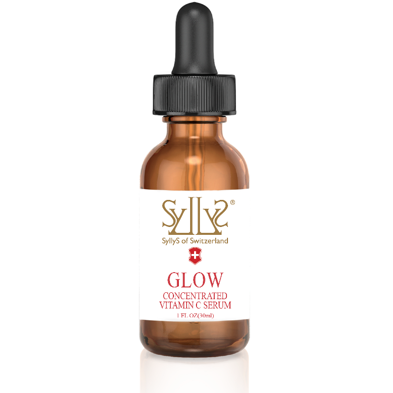 This concentrated stable vitamin C Face Serum is in a clear brown glass bottle with a black dropper. On a white label Syllys of Switzerland logo is printed in gold with the Swiss flag emblem below it. Underneath the logo the title "GLOW" is printed in red and below that in a smaller print also in red “concentrated vitamin c serum”
