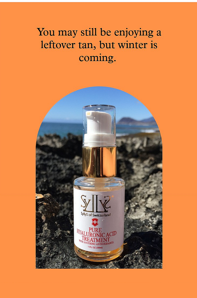 SyllyS Hyaluronic serum with Soothing antioxidants is located on a black reef in Hawaii cwith ocean in the background. A headline on top of it stating "You may still be enjoying a leftover tan, but winter is coming"