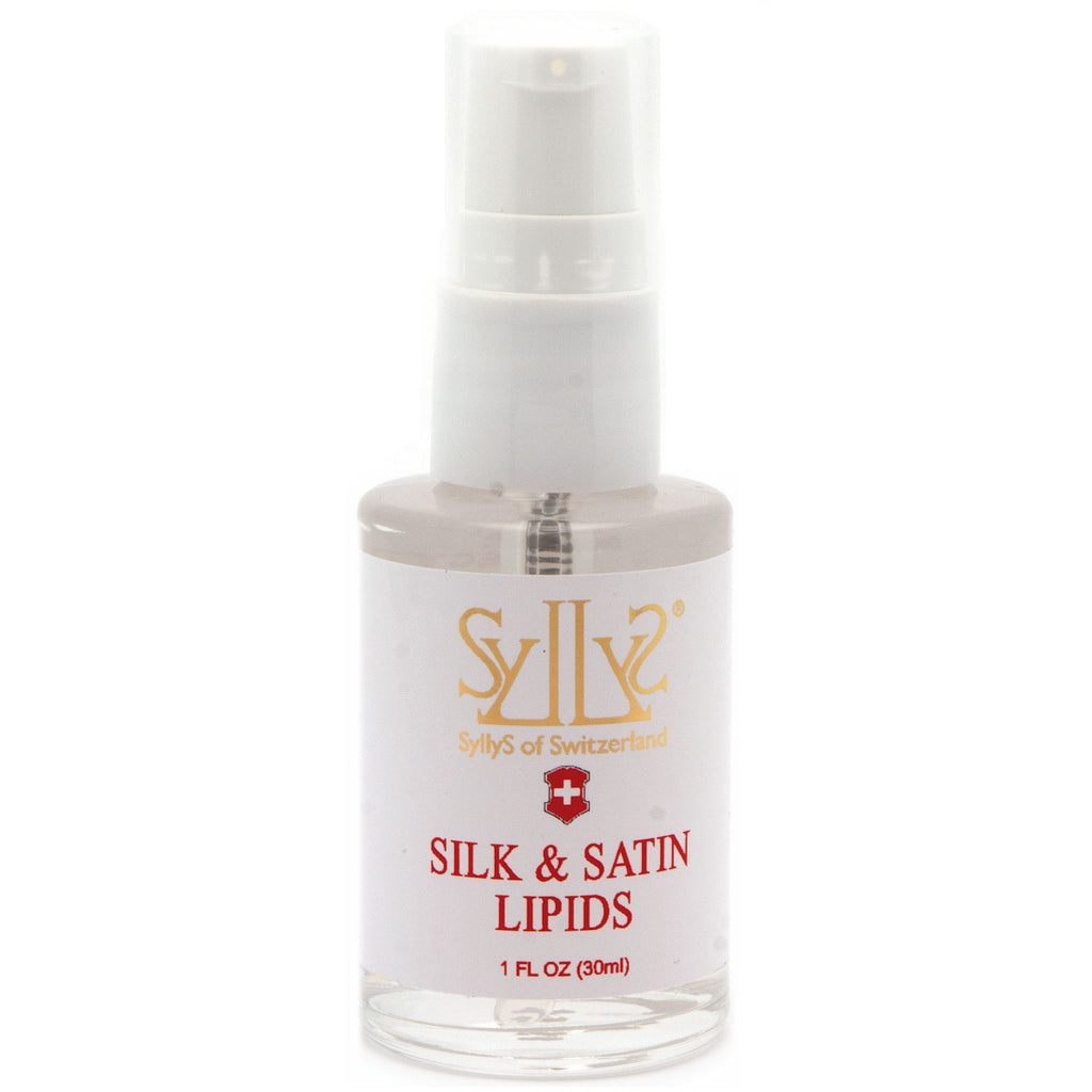 Silk & Satin Lipids is a clear treatment gel type treatment packaged in a clear glass pump bottle. Pump is a white plastic with a gold rim, and lid is clear. The logo Syllys of Switzerland is printed in gold on a white label along with the title "Silk & Satin Lipids" printed in red below the logo. Natural Beauty Made Simple.
